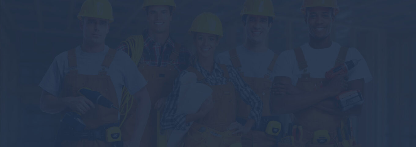 A group of people wearing hard hats and holding tools.
