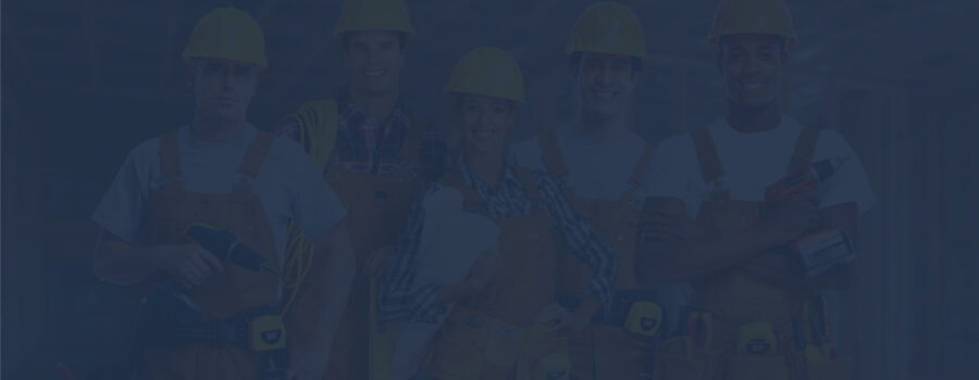 A group of people wearing hard hats and holding tools.